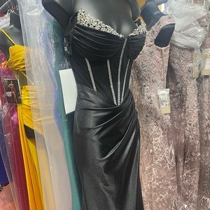 Black formal gown with rhinestone corset. High slit on the left.